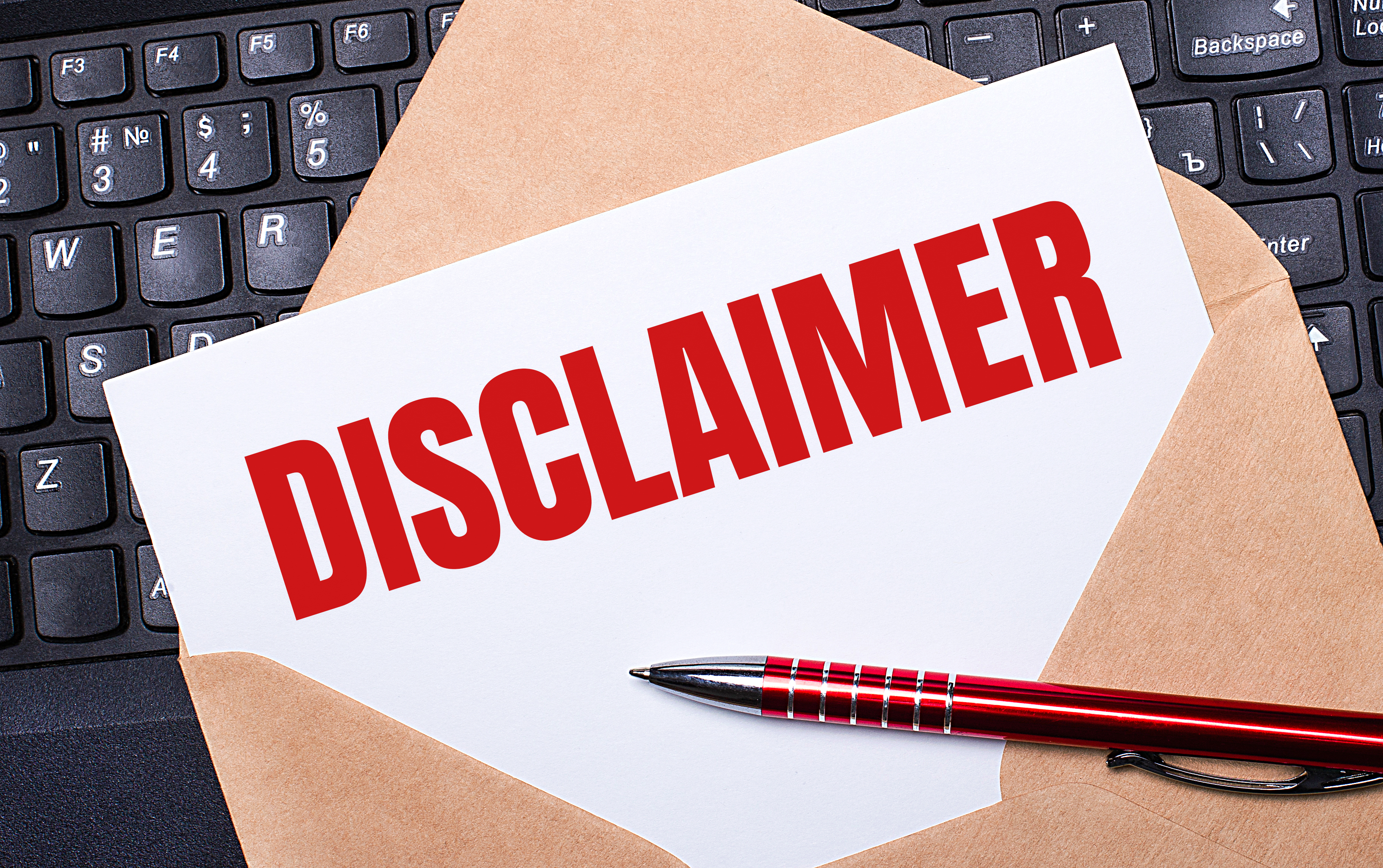 A brown opened envelope containing a white piece of paper with the word disclaimer written in red